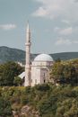 A Minaret Near a Dome Building