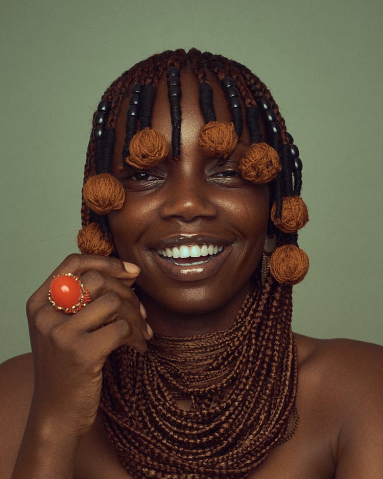 A Portrait Of A Smiling Woman With A Trendy Hairstyle