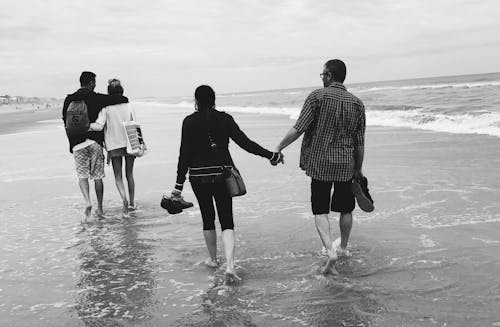 Gray Scale of Two Couples on the Beach