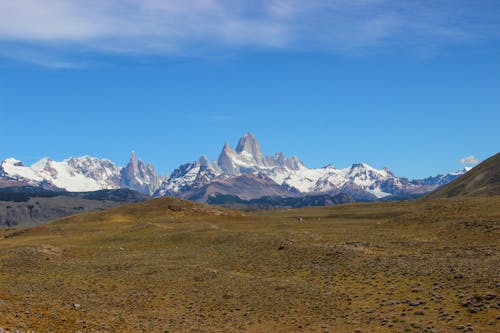 A Snow Covered Mountains Under Blue Sky