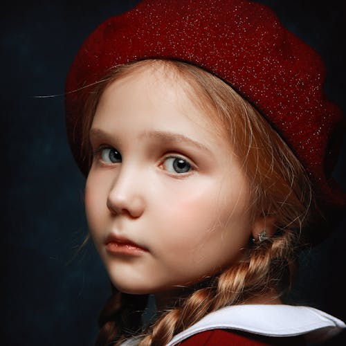 Free Portrait of a Girl Wearing a Red Beret Stock Photo
