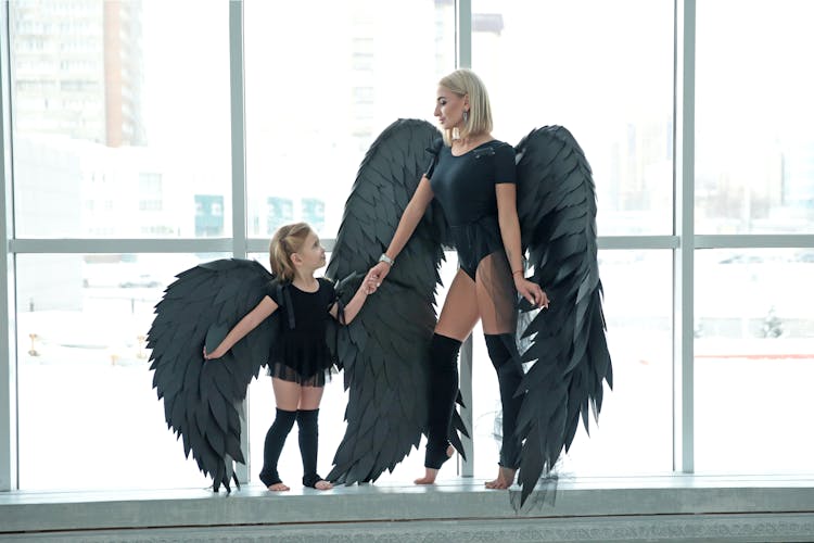 A Mother And Daughter Dressed As Dark Angels