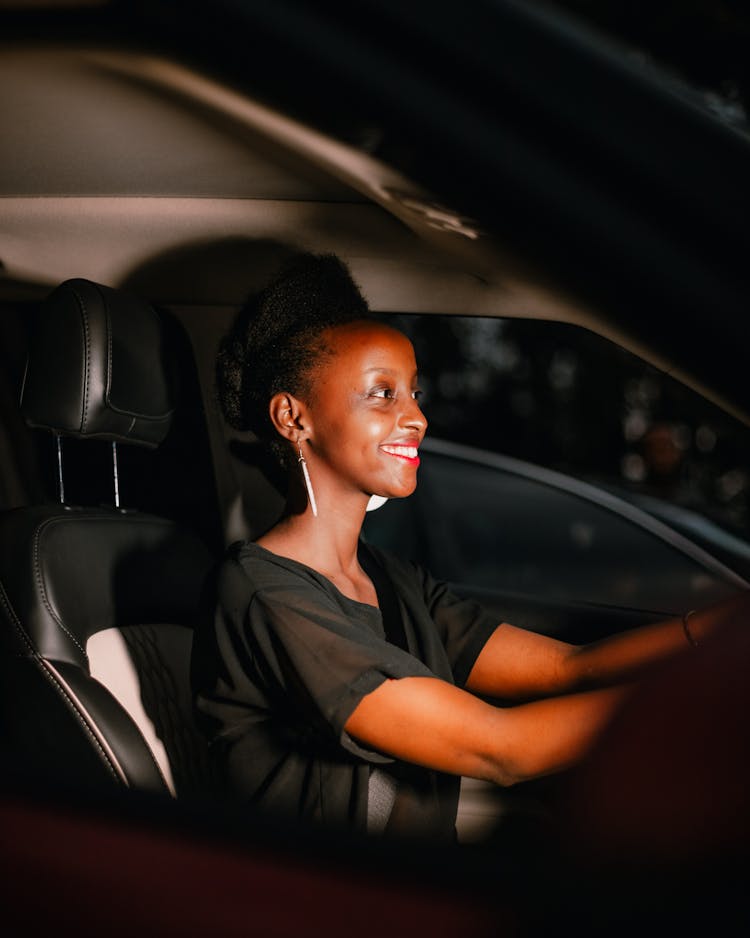 Smiling Woman On Car