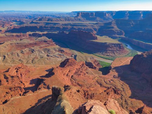 Free Stunning aerial view of Dead Horse Point Canyon's majestic red rock formations and winding river. Stock Photo
