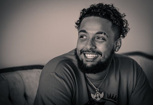 A Man in Crew Neck T-shirt Smiling