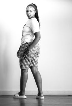 Grayscale portrait of a woman looking back, adding a classic touch.