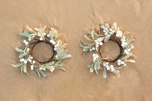 Two Mistletoe Rings on Sand