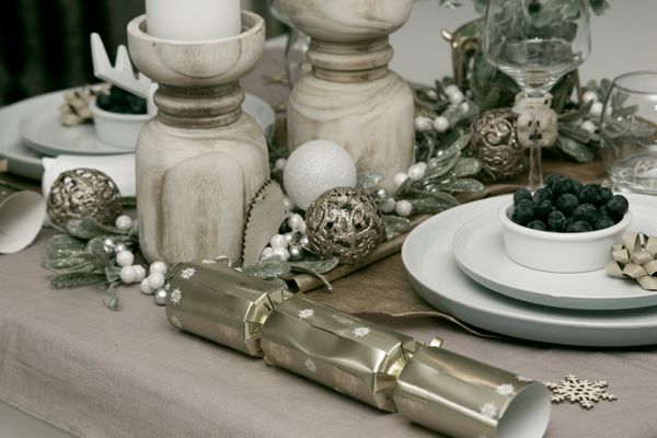 A winter dinner table set with candles — photo by Karen Laark Boshoff on Pexels