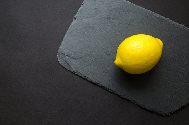 Photo Of Yellow Lemon On Gray Surface