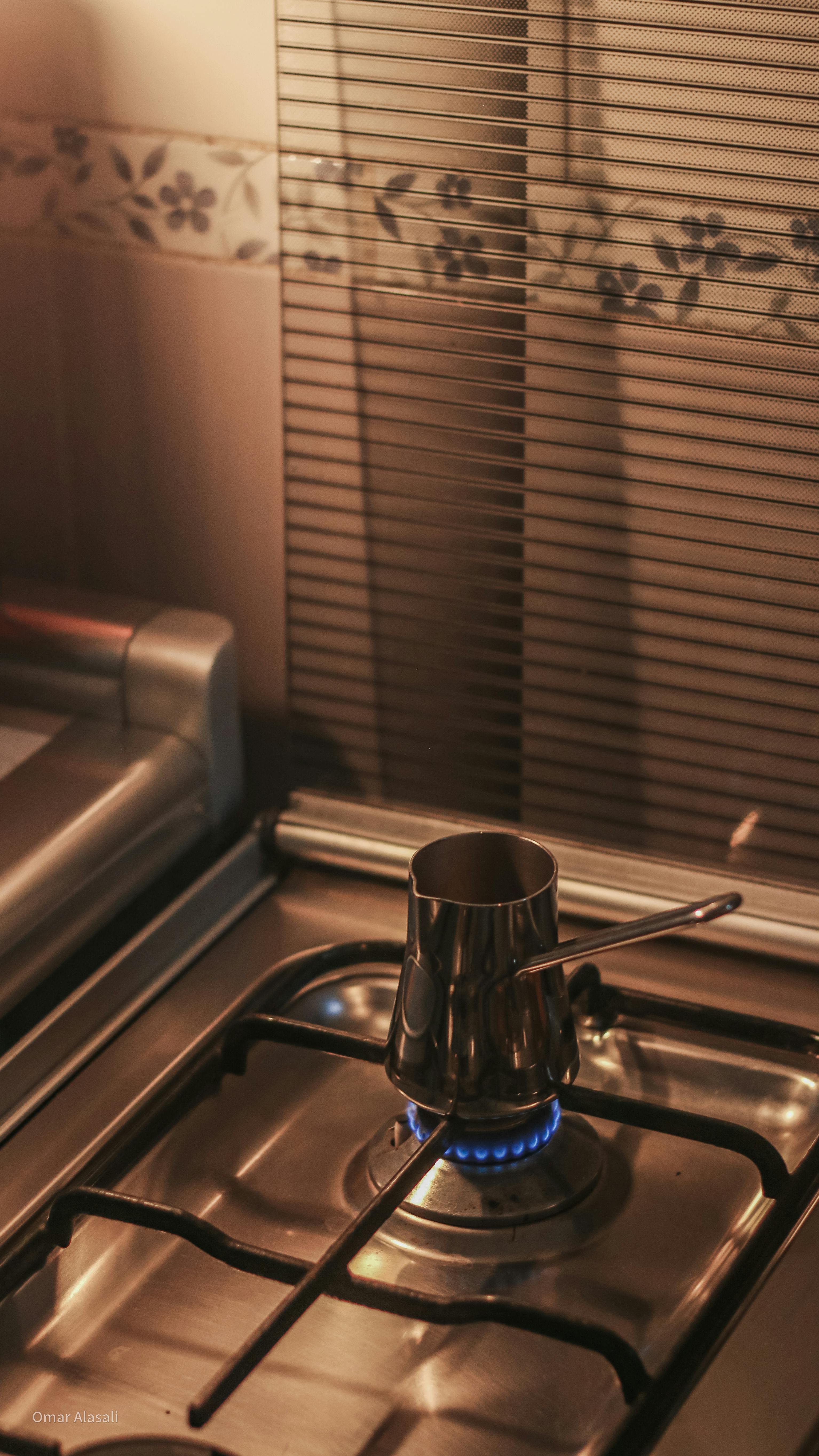 Old Coffee Maker On A Gas Stove Lit With Fire In A Kitchen Stock Photo,  Picture and Royalty Free Image. Image 151197039.