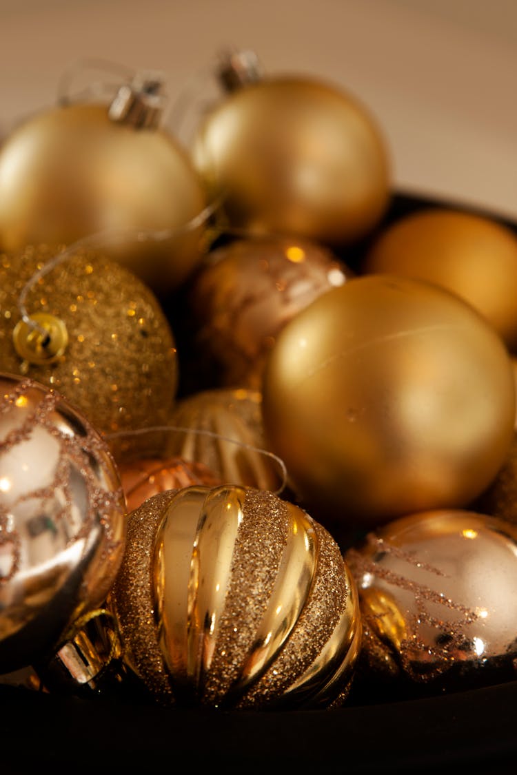 Gold Christmas Baubles In Close-up Shot