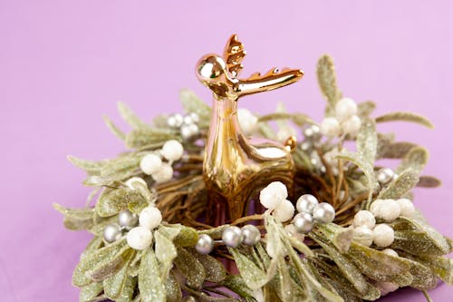 Christmas Wreath and a Gold Reindeer Figurine 