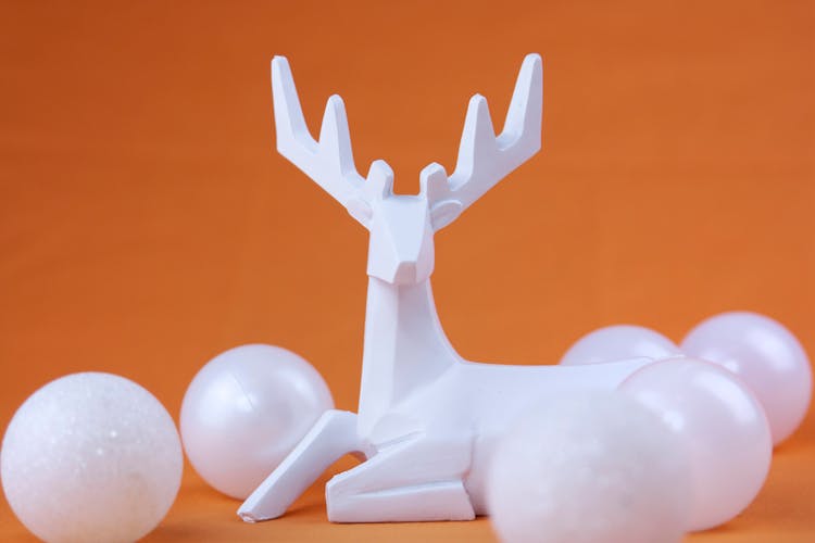 White Figurine Of Deer And Decorative Balls