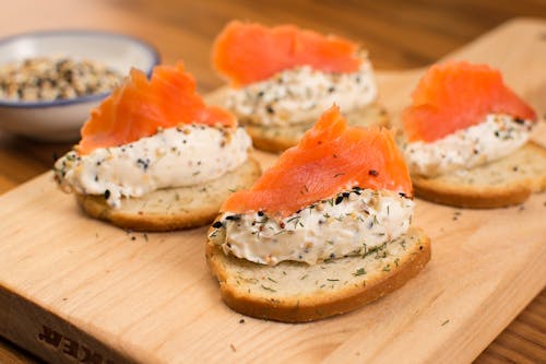 Delicious Salmon Toasts on a Wooden Chopping Board