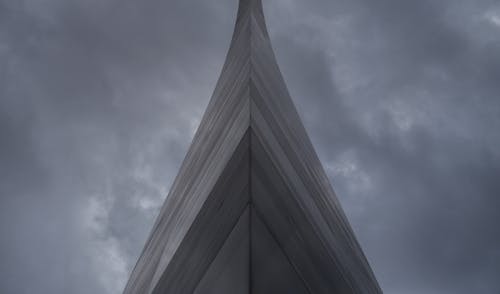 Gray Building Under Dark Clouds