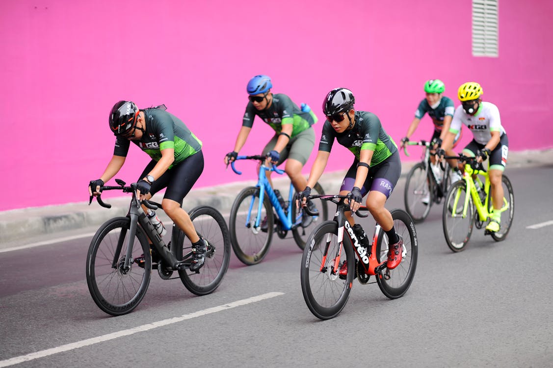 Group of Men Riding on Bicycles