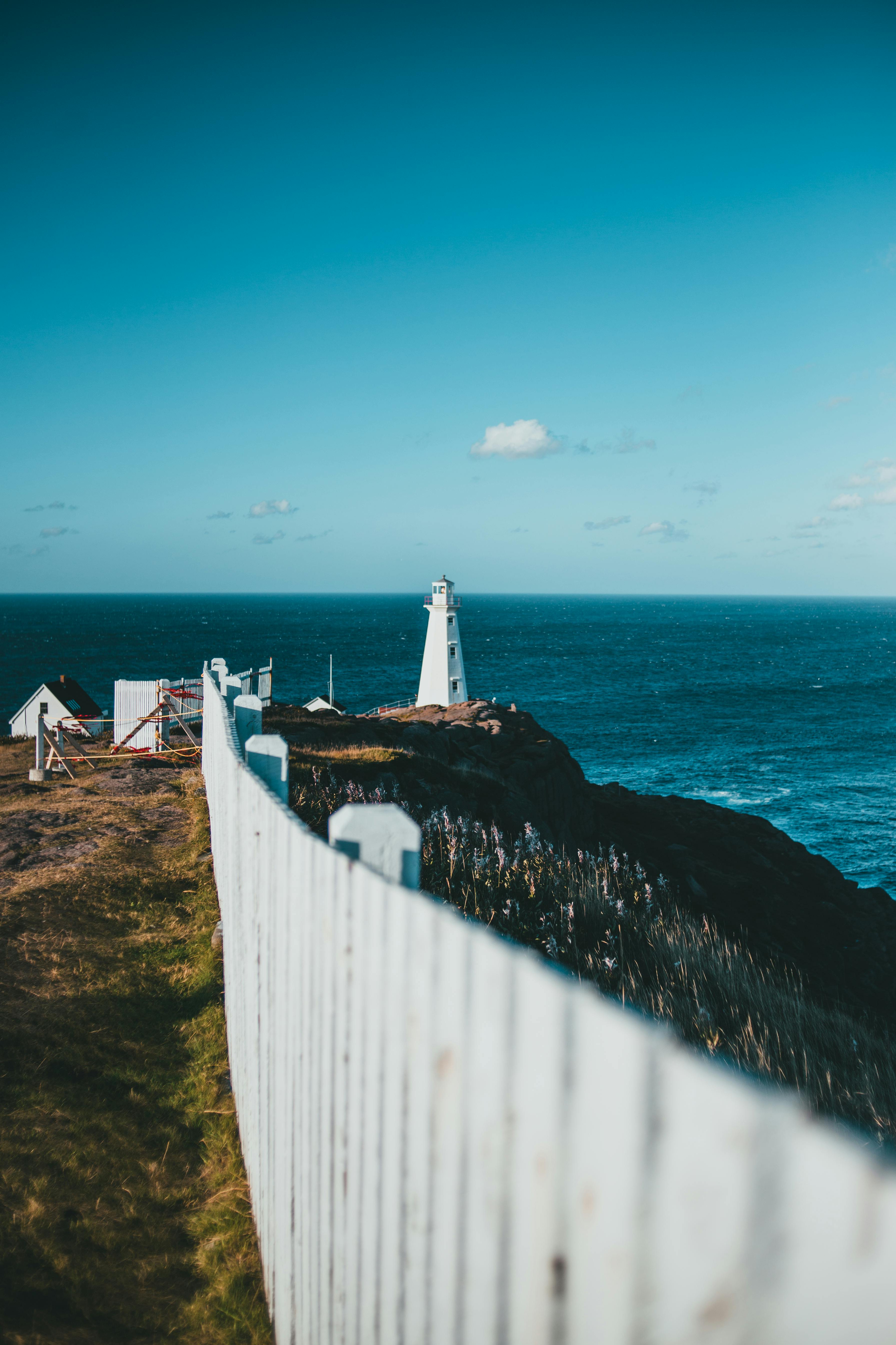 White Lighthouse Near The Cliff · Free Stock Photo