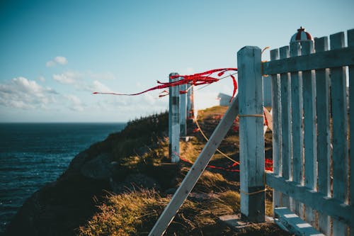 Wooden Fence Near a Mountain Cliff