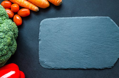 Free Gray Chapping Board Beside Vegetables Stock Photo