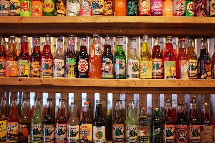 Colorful Bottles Of Soda Pop On Store Shelf