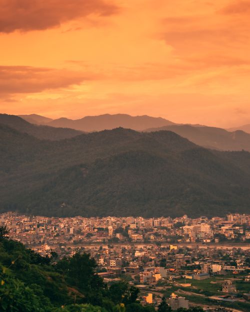 Free Breathtaking view of Butwal city against a backdrop of mountains during a warm sunset in Nepal. Stock Photo