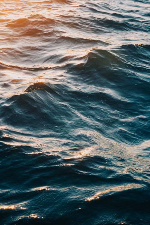 Free A serene view of sunlit waves on the Bosphorus Sea in Istanbul, capturing the movement and light on the water surface. Stock Photo
