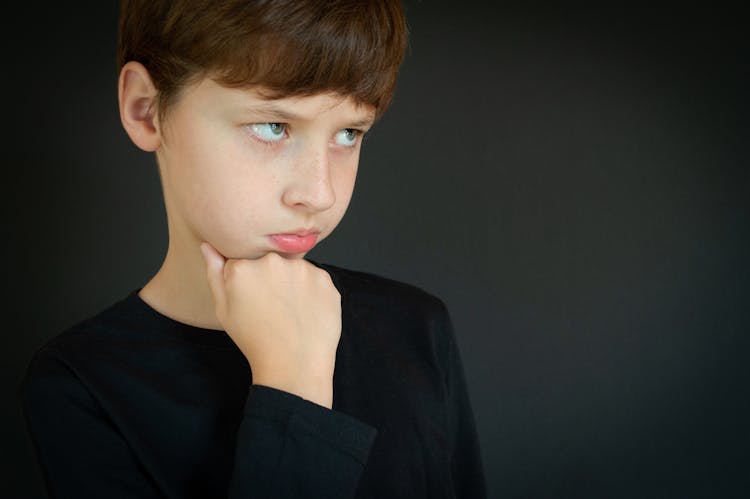 Boy With Brown Hair Pouting