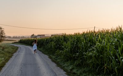 Runner on an empty road at sunrise — photo by Oksana Kriuchkova on Pexels