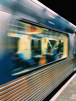 Blurred motion of a subway train speeding through a station in São Paulo, Brazil.