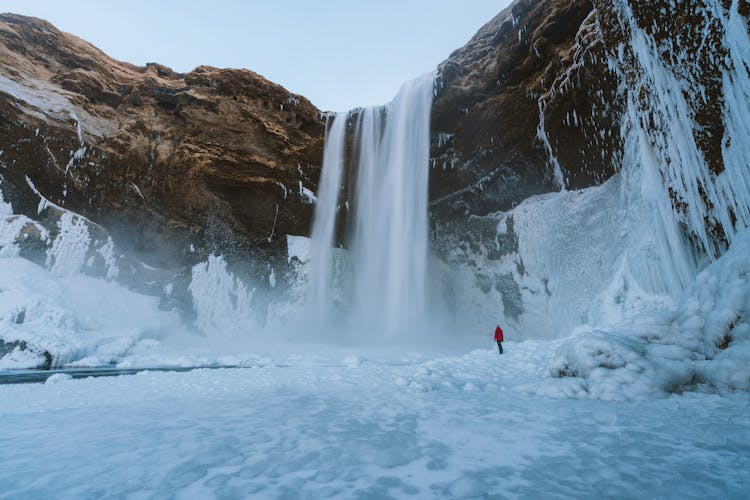 Person Walking On Snowfield