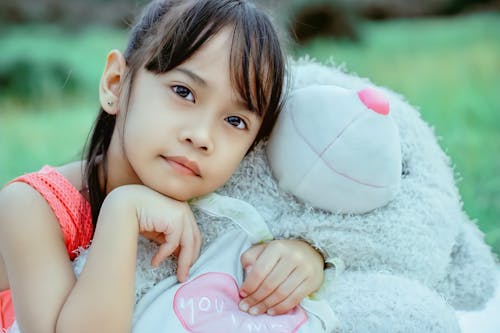 Girl Holding White Teddy Bear 