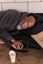A Homeless Man Lying on the Floor