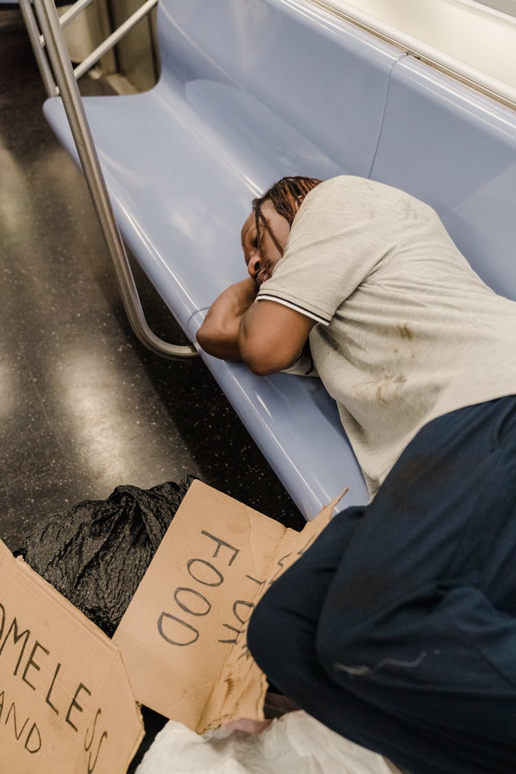 Man Asleep In A Subway 