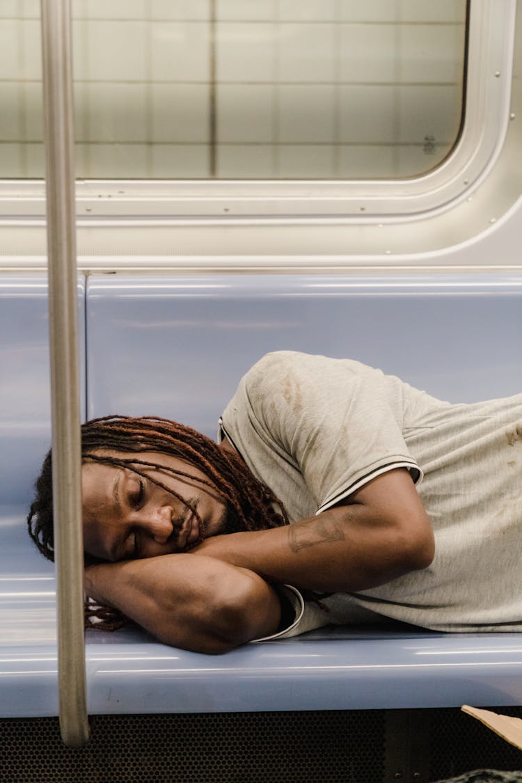 Man Asleep In A Subway 