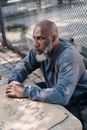 Homeless Man Wearing His Gray Sweater