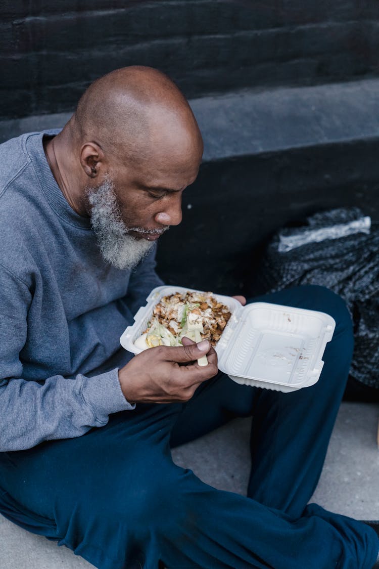 Man Eating A Takeaway Meal