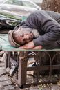 A Man Sleeping on a Bench