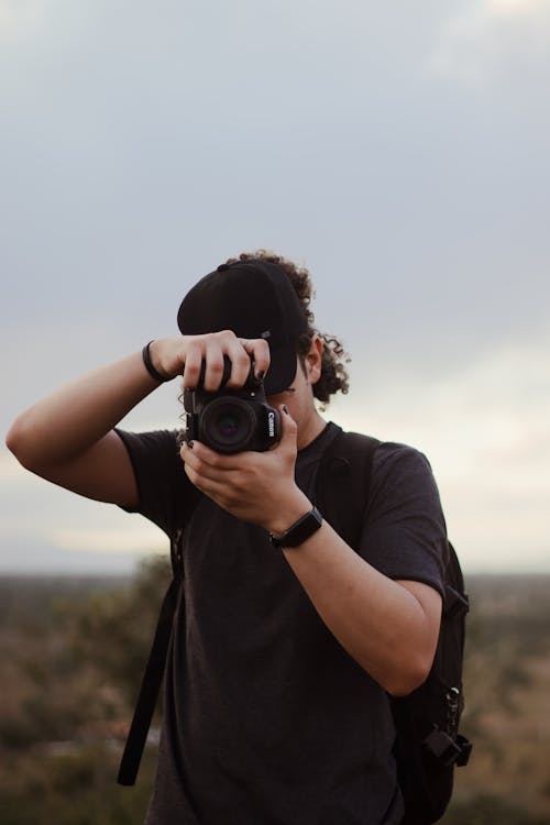 Selective Focus of a Person Holding a Camera