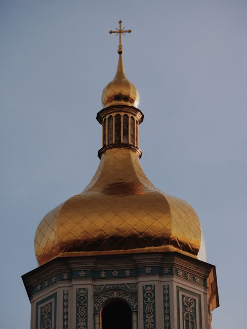 Captivating close-up of the gilded dome of Saint Sophia Cathedral against a clear sky in Kyiv.