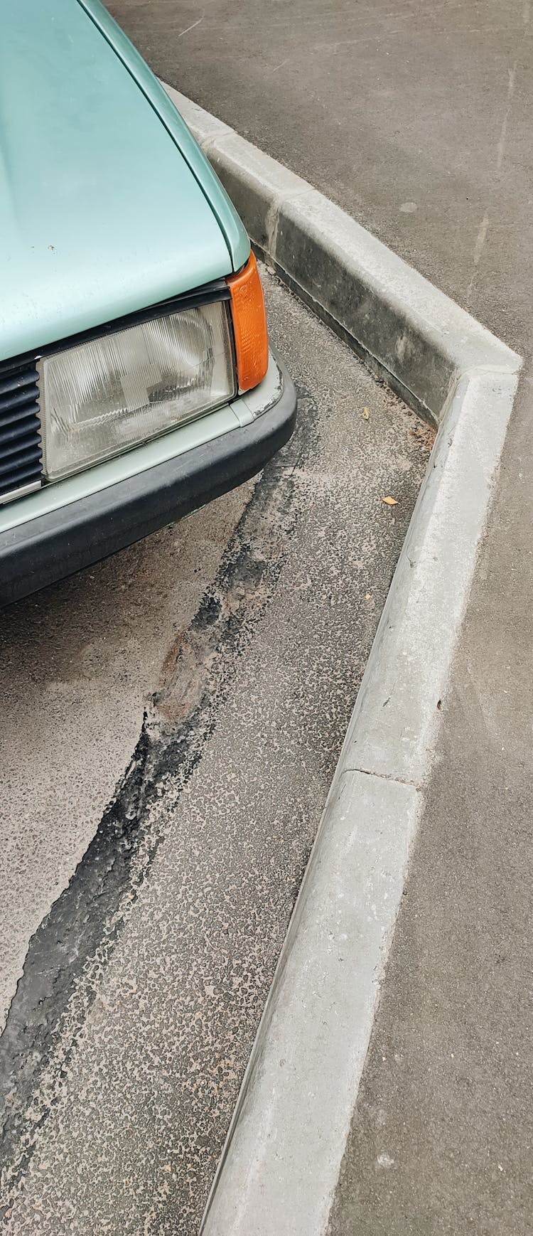 Close Up Of Vintage Car Near Curb