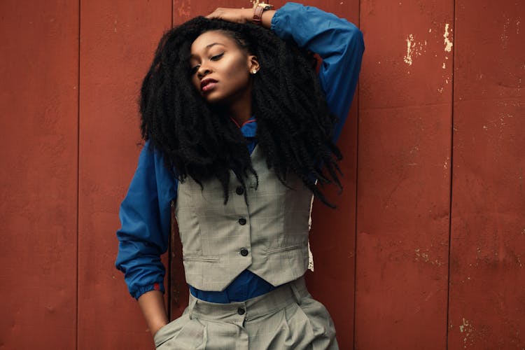 Woman Wearing Gray Waist Coat And Blue Long-sleeved Shirt