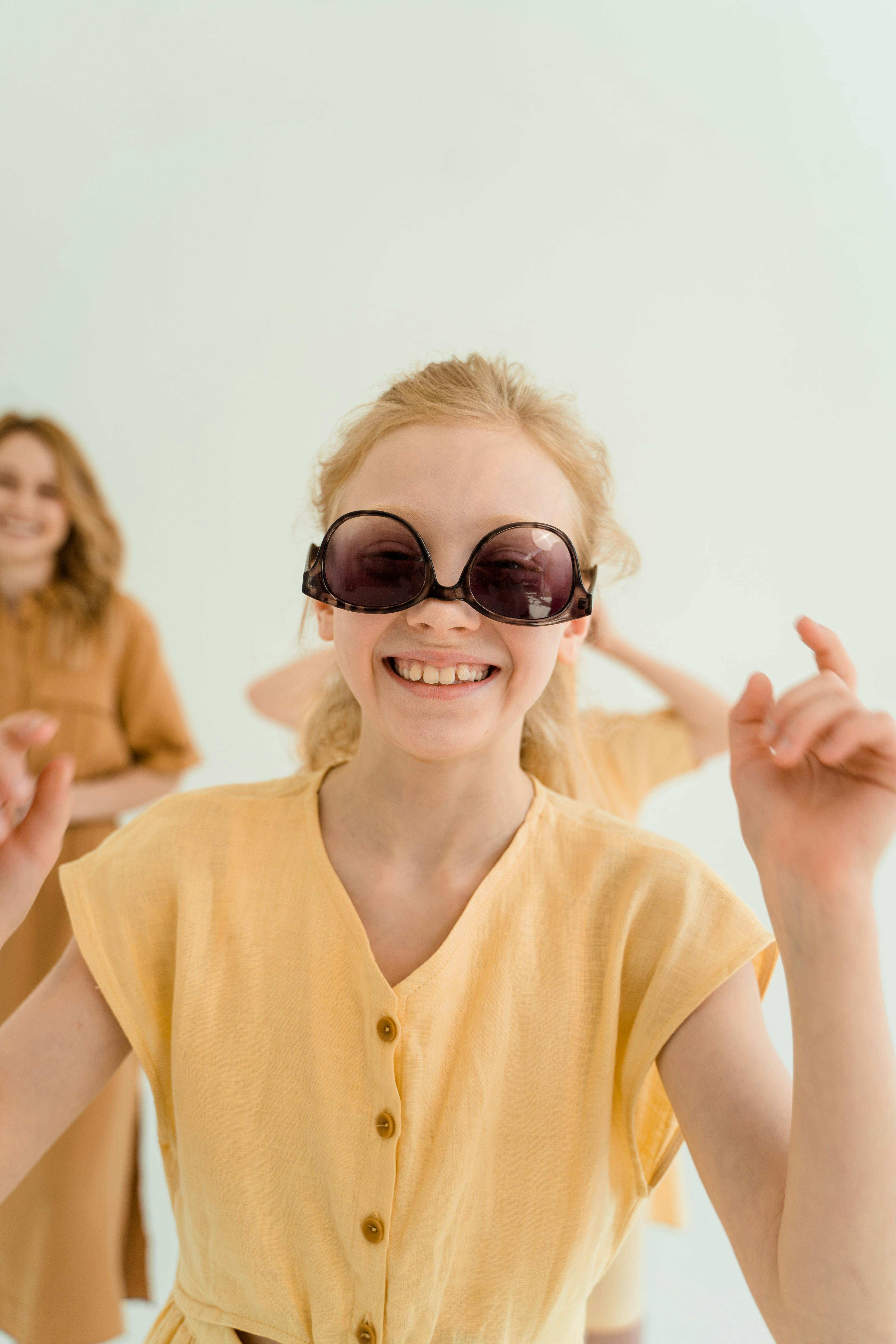 A Girl Wearing Her Sunglasses Upside Down · Free Stock Photo