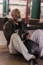 Man in Black Jacket Sitting on Bench