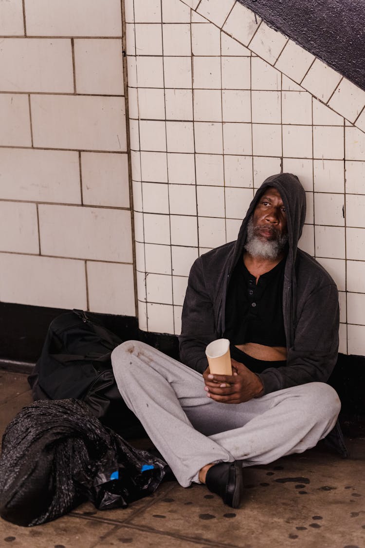 Man Sitting In Subway