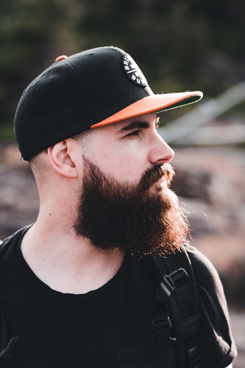 Side View of Full Beard Man Wearing a Cap