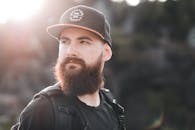Selective Focus Photo of a Man with a Beard Looking Away