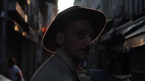 Close-Up Shot of a Man Wearing a Hat