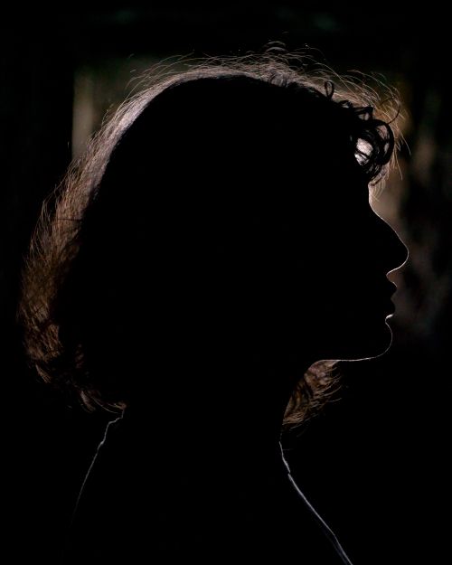 Free Artistic silhouette of a woman captured at twilight in İstanbul, showcasing dramatic shadows. Stock Photo