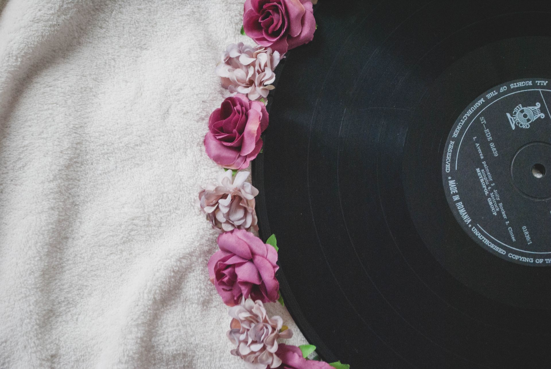 Black Vinyl Disc on White Textile