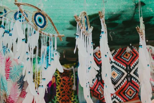 Free Colorful dreamcatchers and textiles on display, evoking vibrant cultural traditions. Stock Photo